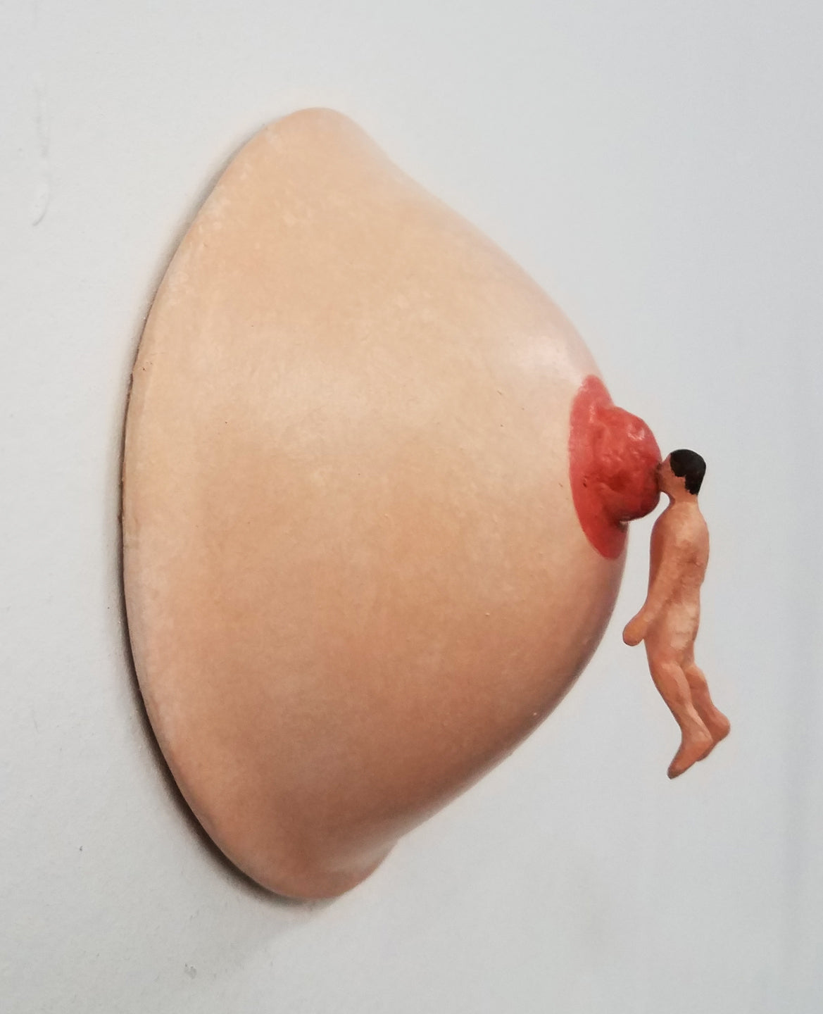 Tiny Man Suckling